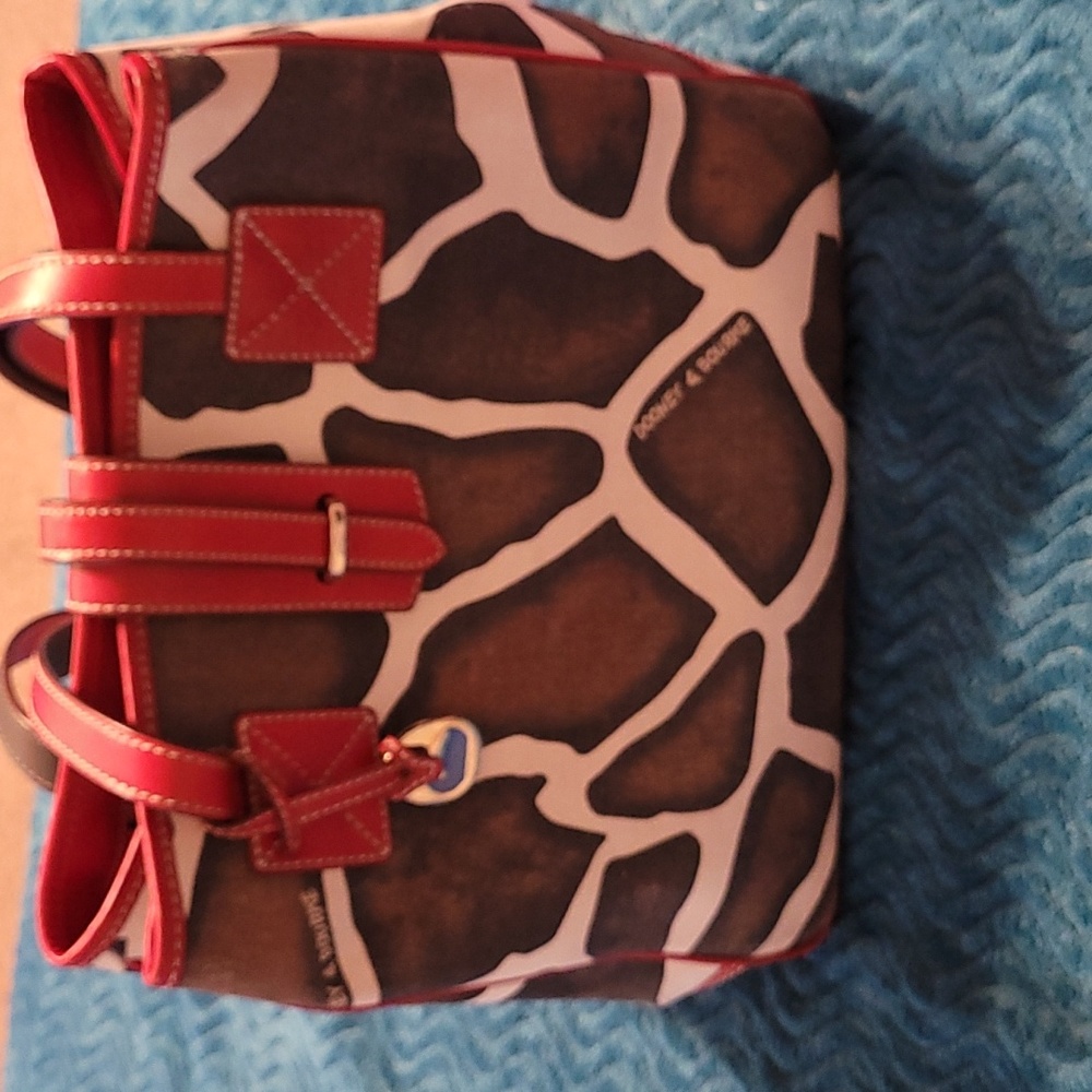 DOONEY & BOURKE COW PRINT EXCELLENT CONDITION